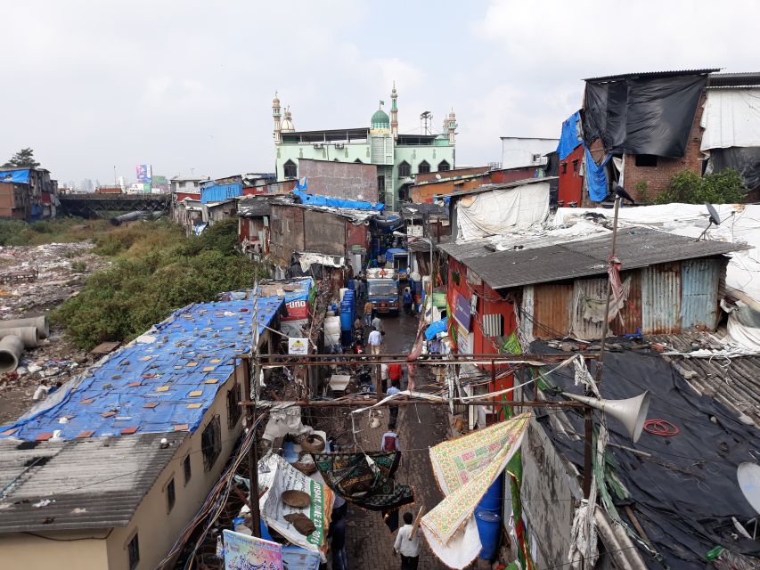 Mumbai: Dharavi Slum Walking Tour with Local Slum Dweller - Recycling in Dharavi: how plastic and oil cans become money and materials